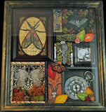 shadowbox art with insect key bat human and goat skull pocket watch moss